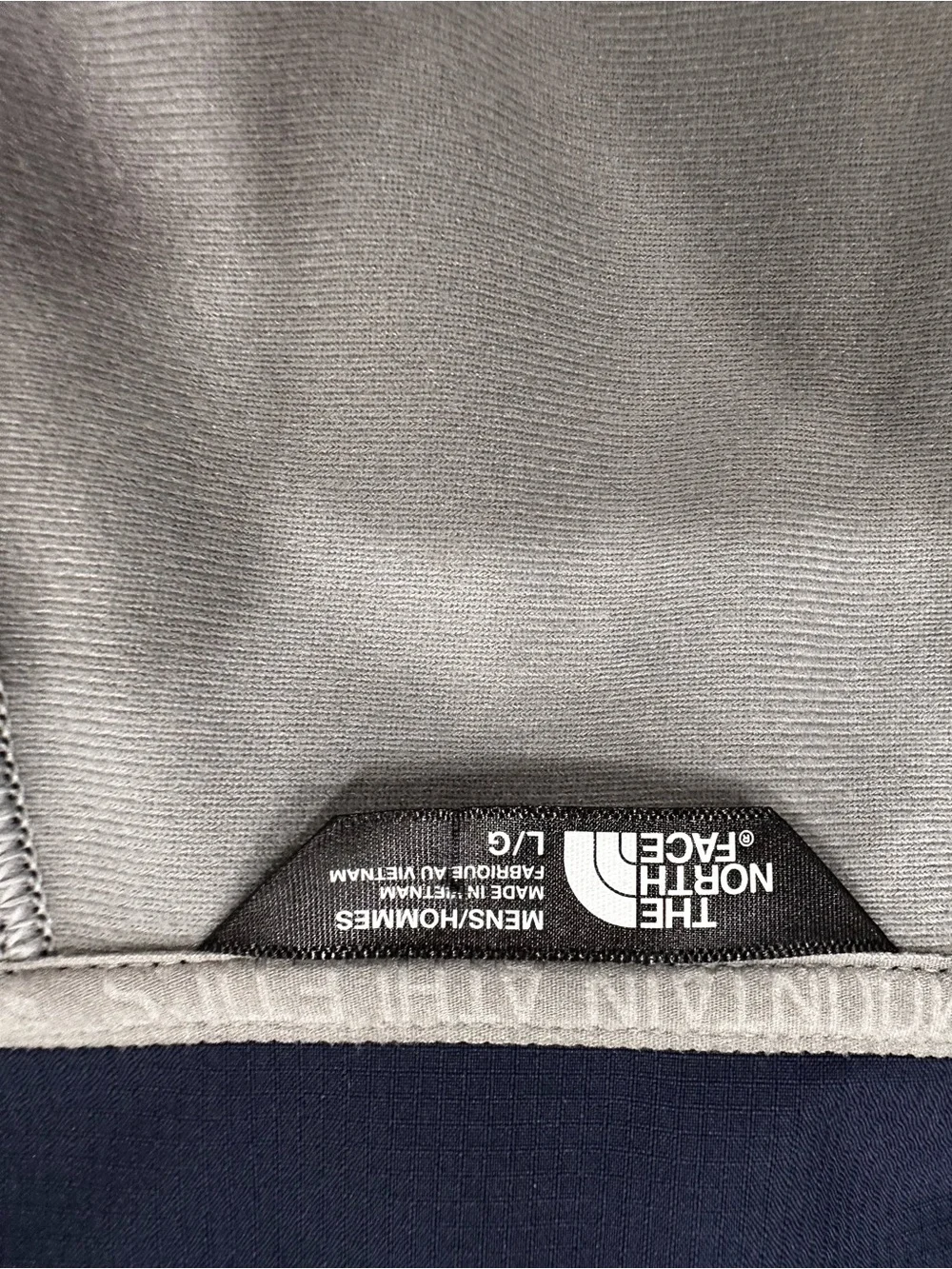 The North Face Navy with Light Gray Sleeve Softshell Jacket. Size L.